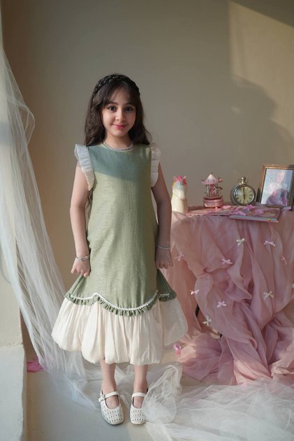 Soft, pistachio-colored, waistless girls' dress