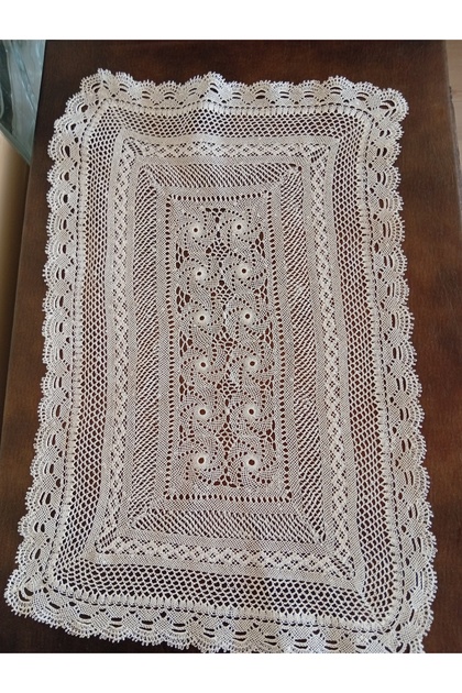 The Needlepoint Made with a White Thread and Needle Is Handmade.