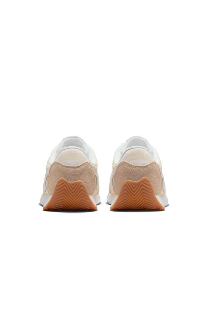 nude color nike sneakers