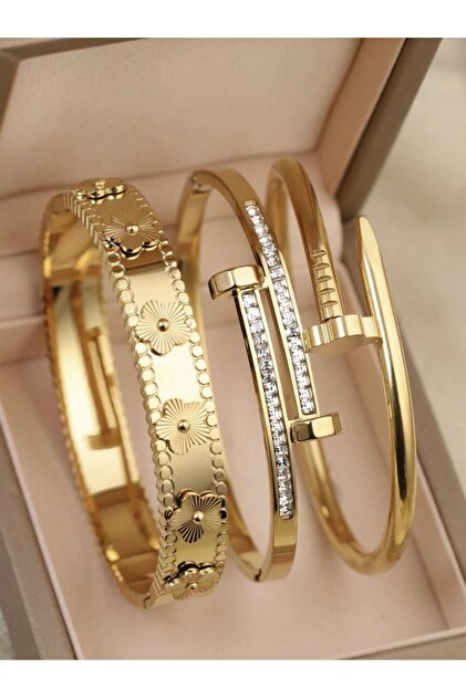 A luxurious 3-piece stainless steel set with a quad design, studded with cubic zirconia for a sophisticated, feminine look.