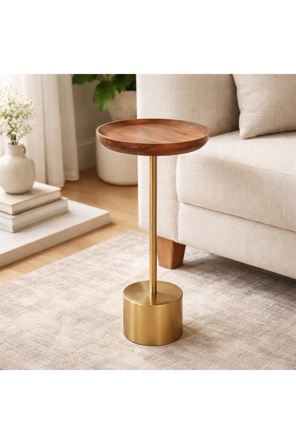 A modern Indian side table featuring a warm wooden top with a sleek gold metal stem and base