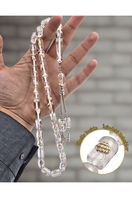 مسبحة صلاة محدودة الإصدار من مسحوق الكهرمان، تحتوي على 33 حبة، بداخلها صدفة بحرية، تأتي مع حقيبة حصرية.