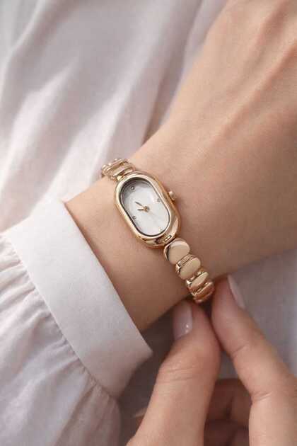 Gold Color Oval Case Curved Metal Strap Women's Wristwatch