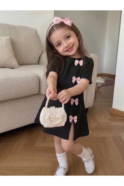 trendypassion Girl's Black Mini Dress with Pink Bow Detail, Modern Design-  Trendyol