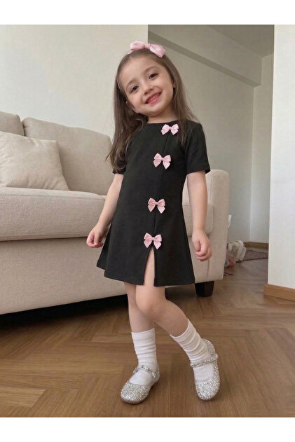 trendypassion Girl's Black Mini Dress with Pink Bow Detail, Modern Design-  Trendyol