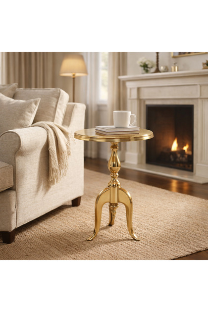 A luxurious all-gold side table with a classic tripod base