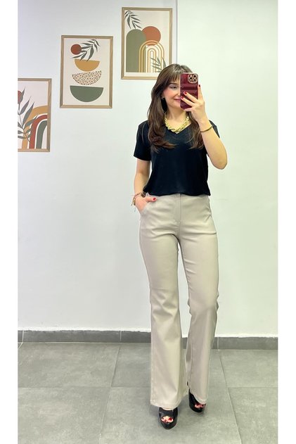High-Waisted, Elastic-Waisted, Buttoned, Spanish-Style Flared Pants with Pockets on Both Sides and Back.