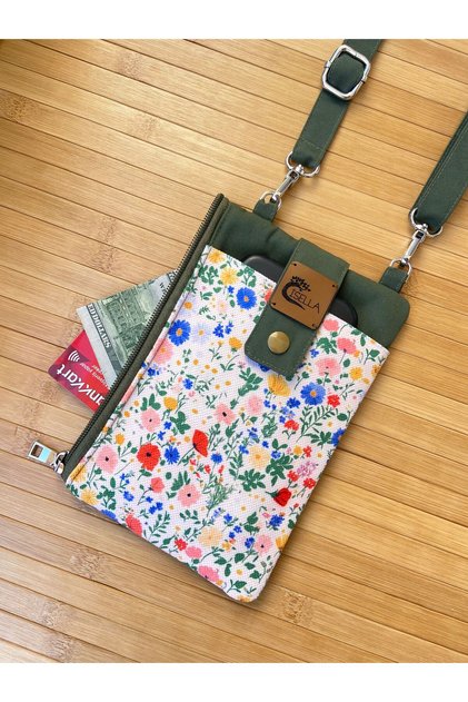 Phone Bag and Wallet Powder with Crushed Flowers on the Background in Khaki