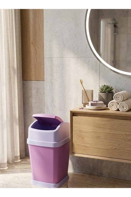 Pink tipping waste container suitable for offices and living rooms