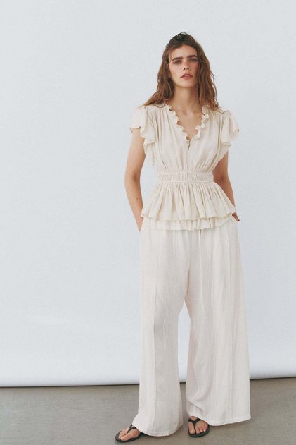 Flutter-sleeved peplum blouse