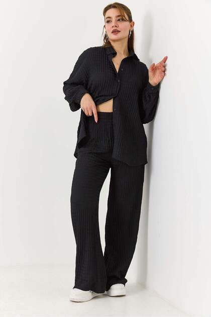 Women's black button-down shirt and pants set