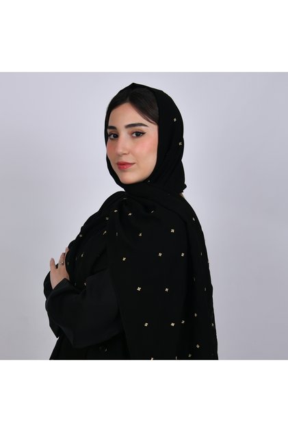 طرحه حرير بلون اسود و زهور ذهبيه صغيره متفرقة