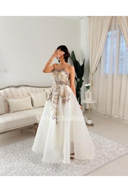 4876- A luxurious off-white dress with unique royal embroidery