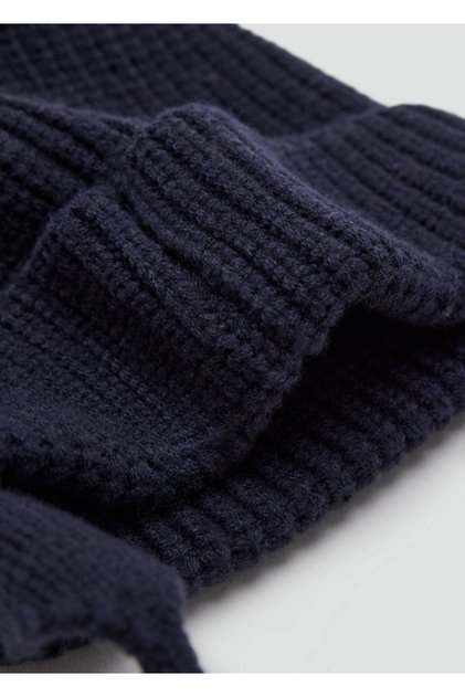 Knitted hat with pom-pom and earflaps