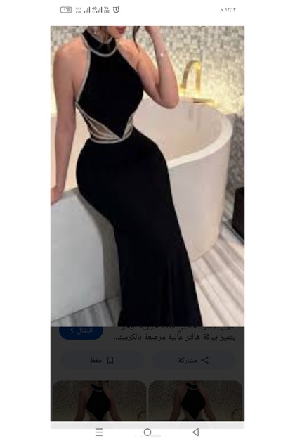 فستان سهرة اسود طويل بتصميم أنيق وفاخر بقصه حوريه البحر ياقه هالتر مرتفعه مزينه بفصوص لامعه