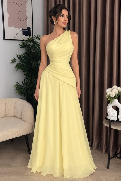 Elegant Light Yellow Evening Gown Featuring a One-Shoulder Cutout and Soft Cascading Ruffles on the Bust.