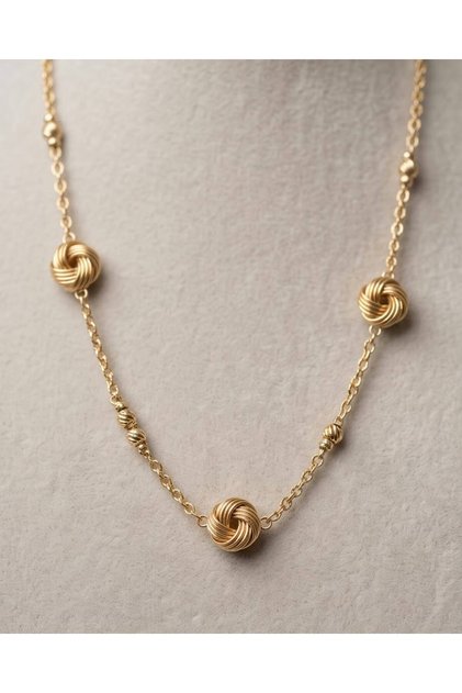 Elegant Necklace with Gold-Colored Knot Detail