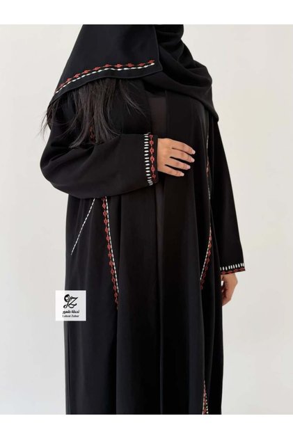 Abaya Anwar in Black, Somber Andonese Fabric with Hand Embroidery Inserts.