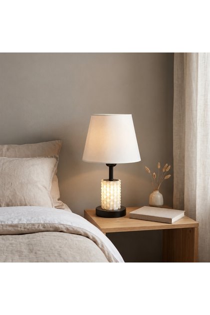 An elegant table lamp with warm lighting and a touch of luxury.