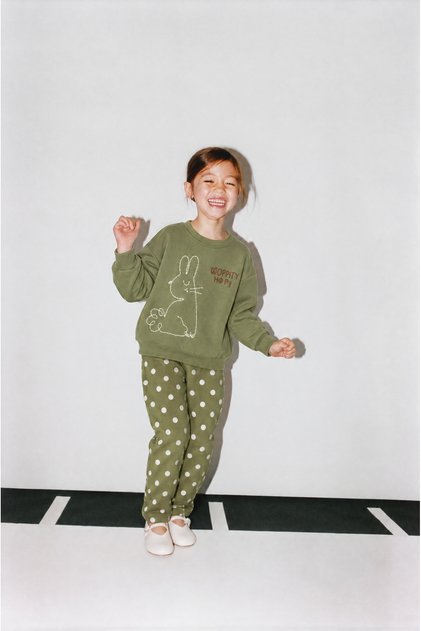 Girls' cotton sweatshirt with rabbit print and matching patterned tracksuit set.