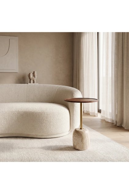 An elegant modern side table featuring a round brown wooden top