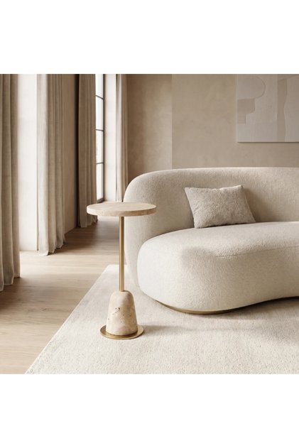An elegant modern side table featuring a round light beige stone-look top
