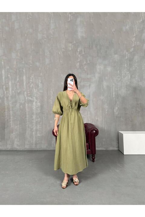 FİOXCO Vayla Çağla Yeşil Müslin Kumaş V Yaka Bel Lastikli Balon Kol Midi Yırtmaçlı Yazlık Elbise