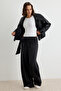 Siyah Premium Lyocell İçerikli Yazlık Wide Leg Kuşaklı Normal Bel Uzun Örme Pantolon TWOSS26PL00165
