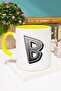 كوب بتصميم حرف B