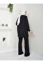 Women's modest outfit with slit hem, zipper detail, and trousers. - 2
