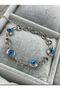 silver color bracelet with steel evil eye beads