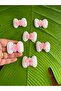 4x3 cm, 6-piece embossed bow/emblem applique sewing accessory, Pink. - 3