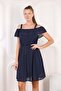 Navy blue women's dress with ruffled shoulder
