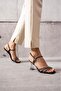 Around stone detailed high-heeled women's evening shoes.