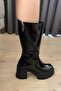 Women's Gabri Black Patent Leather Swivel Zippered Boots - 4