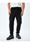 Sweatpants with Lace-Up Waist, Elastic Cuffs, Zipper Pockets, and Cotton Details. - 3