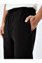 Sweatpants with Lace-Up Waist, Elastic Cuffs, Zipper Pockets, and Cotton Details. - 5