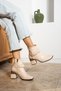 Tharsa Women's Boots & Booties Wrinkled Strappy Thick Heeled Beige Patent Leather