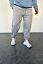 بنطال رياضي من القماش السادة قصة فضفاضة باللون الرمادي للجنسين
