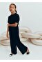 Langer Lurex-Overall