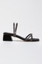 Stylish Shoes with Short Heels and Ankle Ties and Different Tpuck Detail
