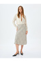 Polka dot patterned midi length flared viscose skirt.