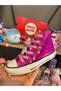 Girl's pink holographic sneakers with zipper, non-slip sole, and ankle support.