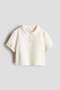 Embellished rib-knit top