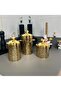 A set of three different-sized acrylic containers for storing spices, legumes, and sugar, in a gold color. - 8