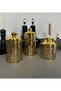 A set of three different-sized acrylic containers for storing spices, legumes, and sugar, in a gold color. - 7