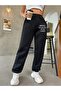 حماية بنطال رياضي Jogger - أسود مطبوع بأرجل مطاطية وخصر مرتفع