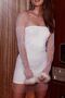 SHORT ELEGANT DRESS WITH FEATHERED STONES AND FEATHER DETAIL
