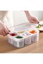 A lidded refrigerator food storage container with 6 removable drain baskets; white plastic food container.