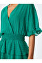 Tiered voluminous v neck polka dot gipped mini dress. - 5